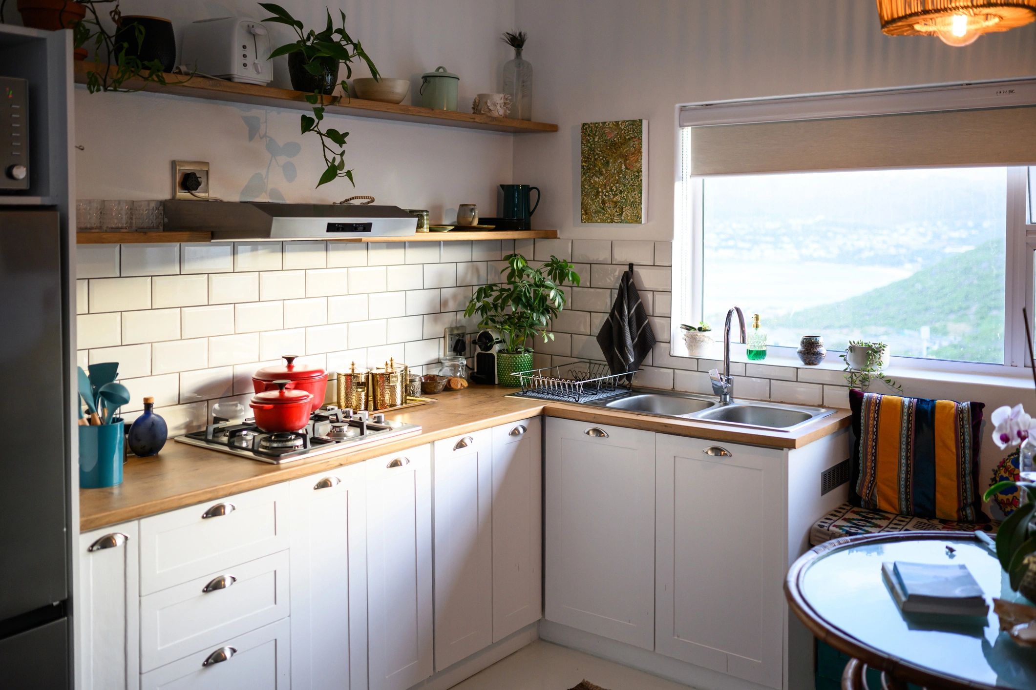 Bright modern kitchen with white cabinets and open shelves