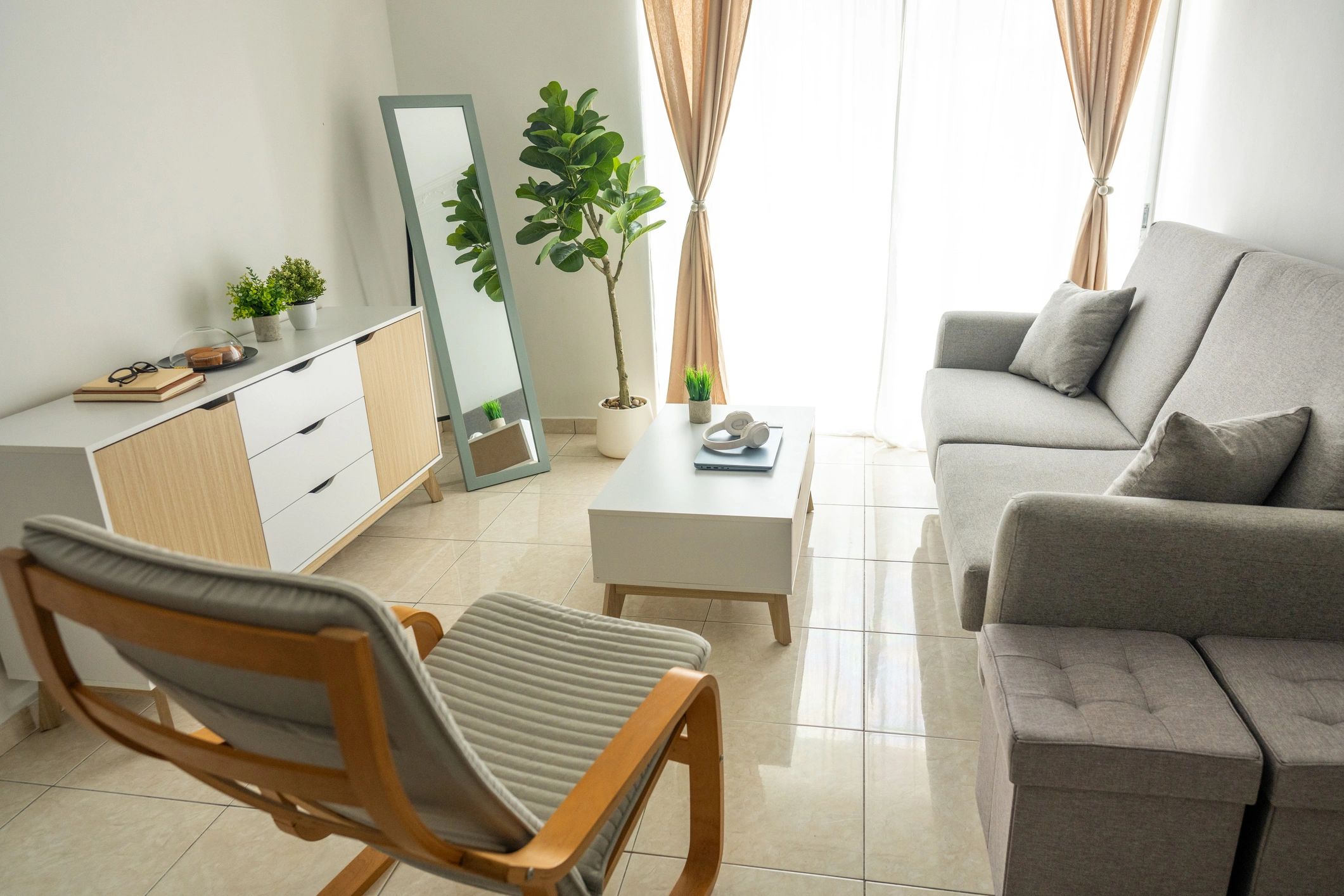 Modern living room with grey sofa and armchair